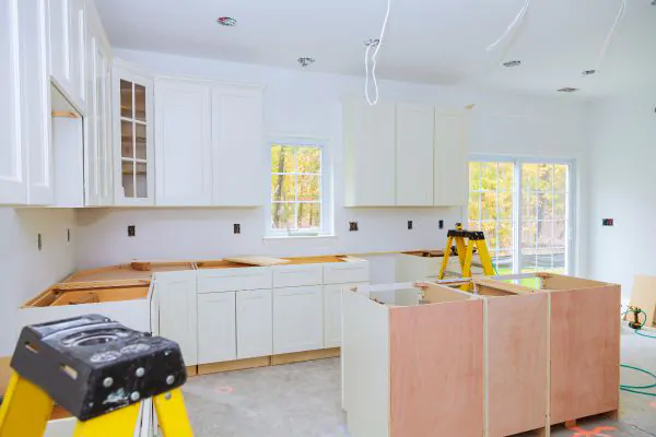 protect surrounding areas with plastic wraps following one of the tips for a kitchen renovation project.