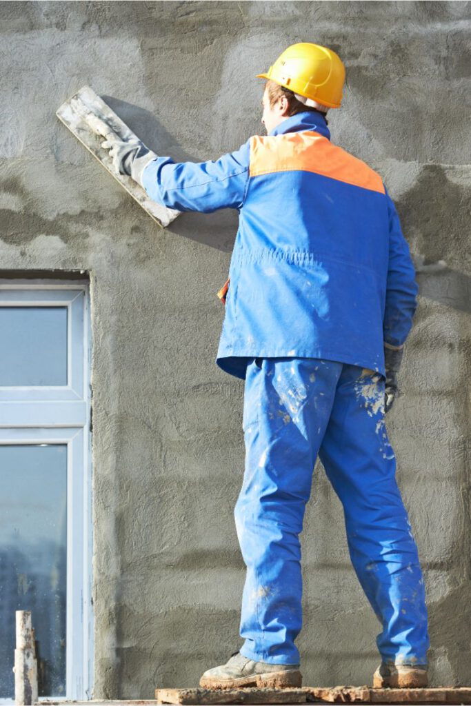 Stucco contractor working exterior wall